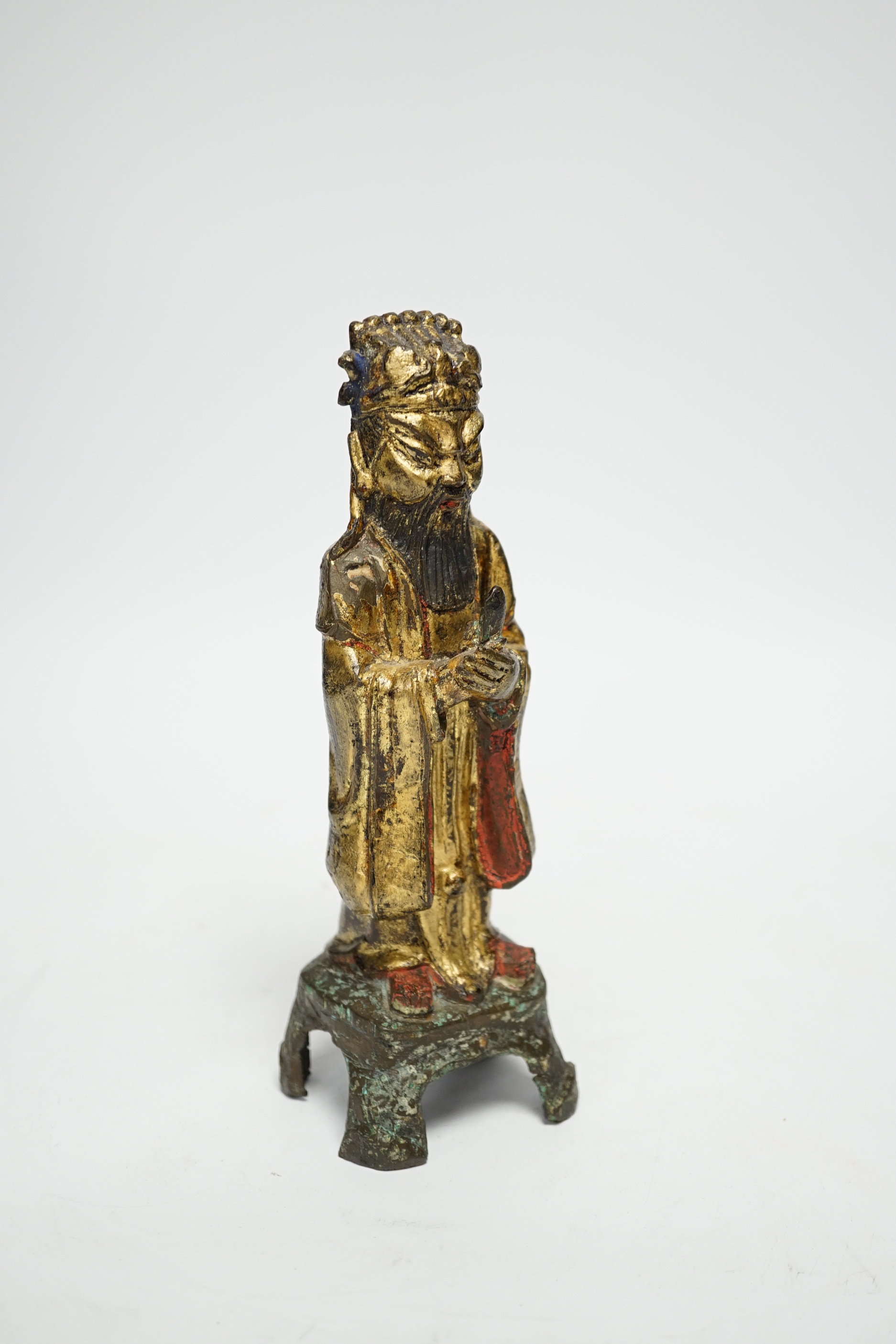 A Chinese late Ming polychrome bronze figure of an immortal, 20.5cm high